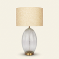 Aurora Ribbed Glass Lamp Base Clear Table Lamp Large Linen Shade on a warm cream background
