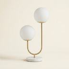 Metal 2-Light Globe Table Lamp on a warm cream background